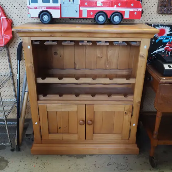solid rimu wine rack/cabinet with 2 doors and stemmed glass storage