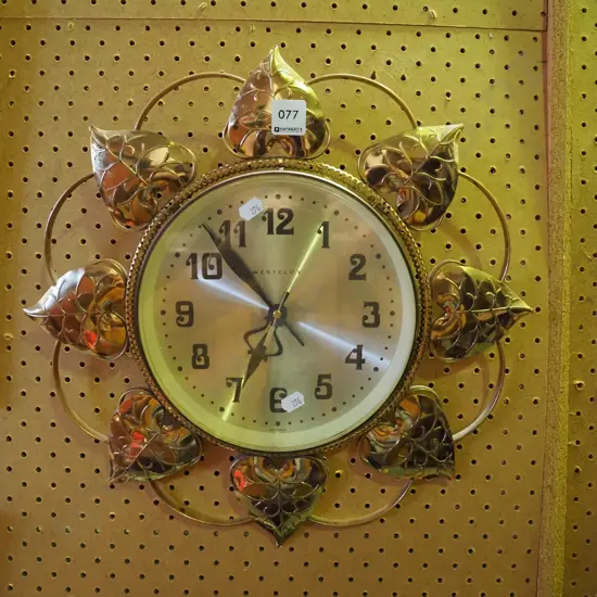 very retro brass framed wall clock