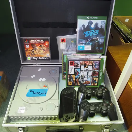 metal equipment case with Playstation - no power cord 1 controllers, various X-box games etc