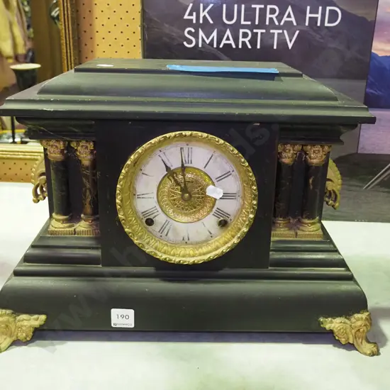 restorer's wood cased black  and gilt painted mantle clock