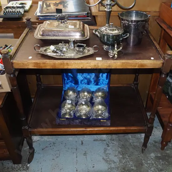 dark stained wooden tea  trolley