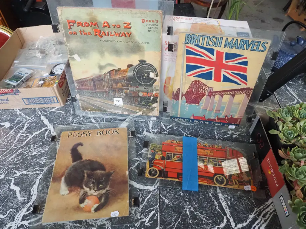 various vintage book covers between pressed glass Image 1++