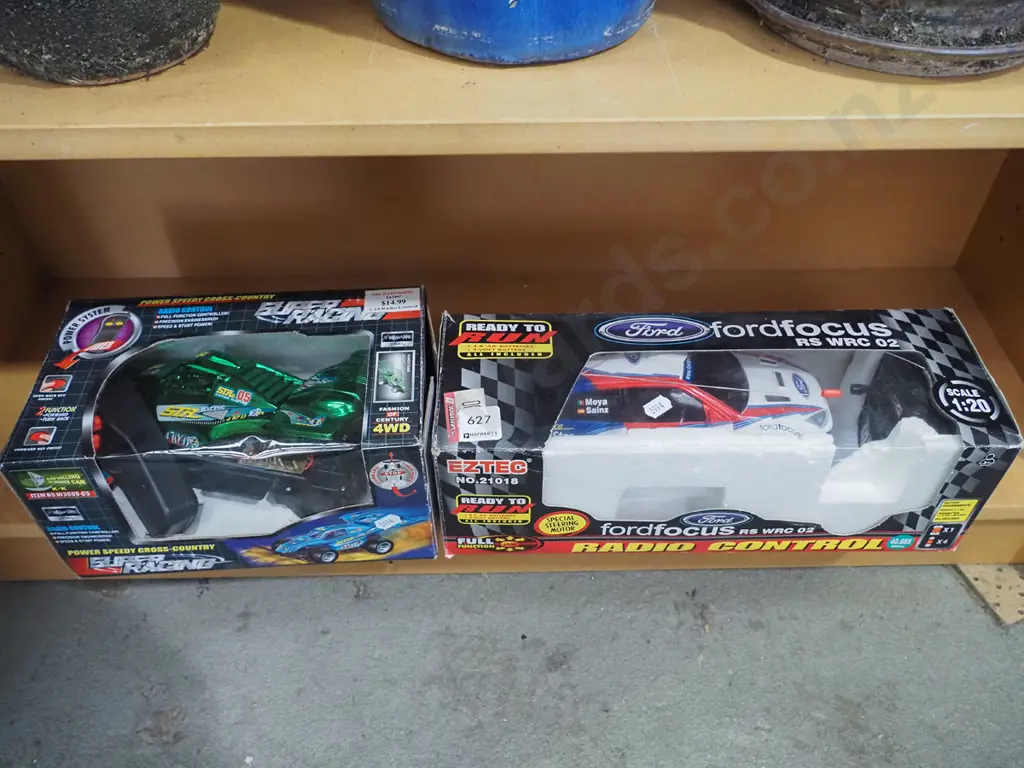 2x boxed remote control cars Image 1++