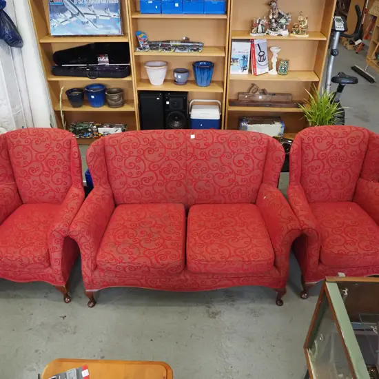 3 piece red upholstered wingback lounge suite - 2 seater, 2 singles - 1 chair has small rip