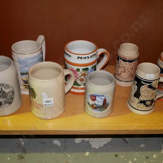 shelf of ceramic beer steins - some cracks