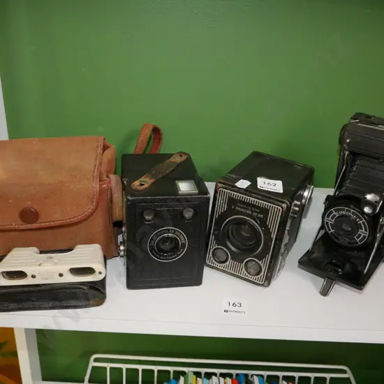 boxed Brownies, opera glasses, concertina camera