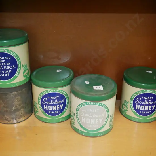 shelf of vintage honey tins