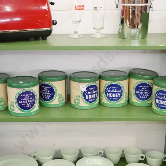 shelf of vintage honey tins