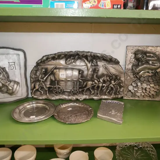 shelf of pewter and faux-pewter composite 3D wall plaques, one with chip, and 2 small trays