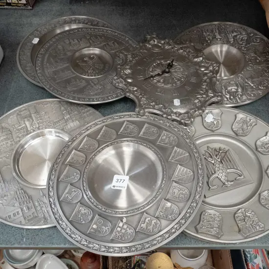 various pewter wall chargers, clock