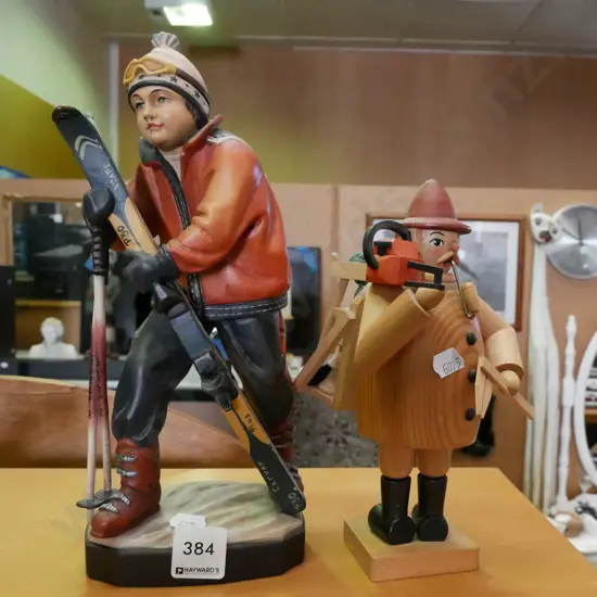 2x carved figurines  - wooden lumberjack, skier H-270