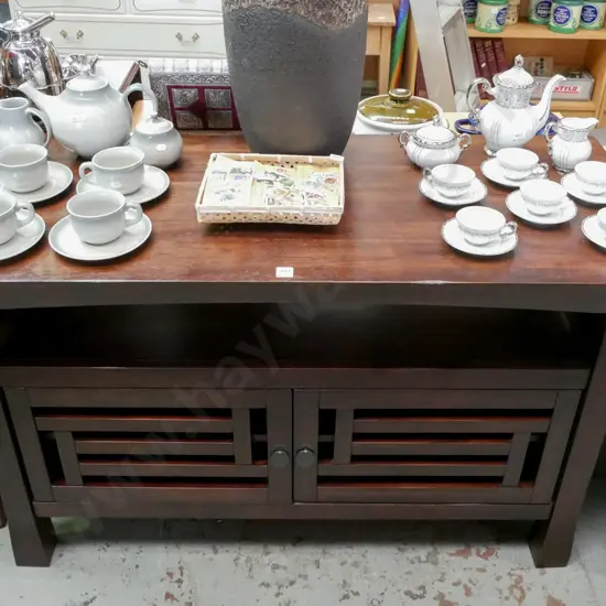 dark stained wooden sideboard w/ 2 doors and metal drop leaf handles H-770 W-1260 D-535