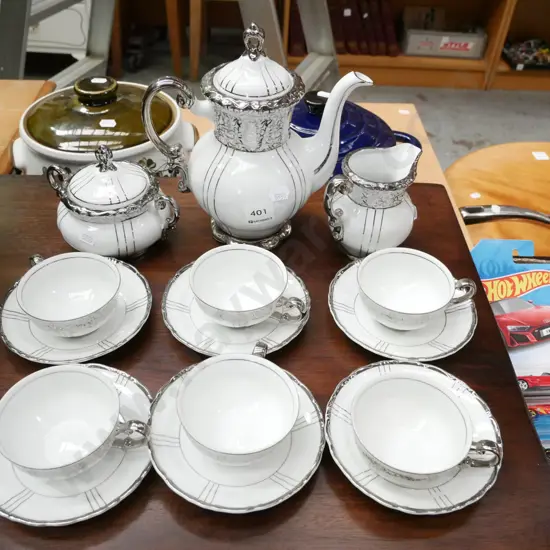 yellow and silver coffee set