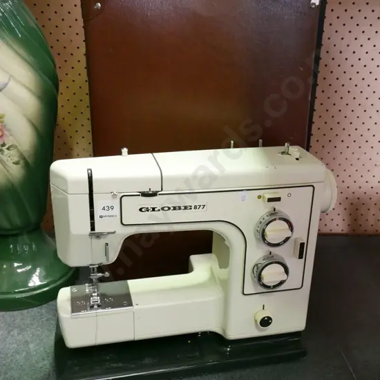 Globe 877 sewing machine in suitcase holder