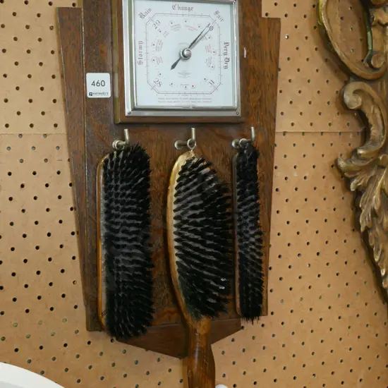 oak wall mounted barometer with clothes brushes