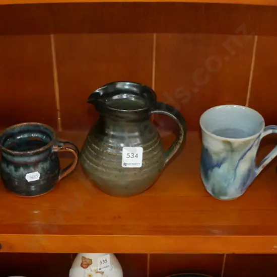 shelf of studio pottery