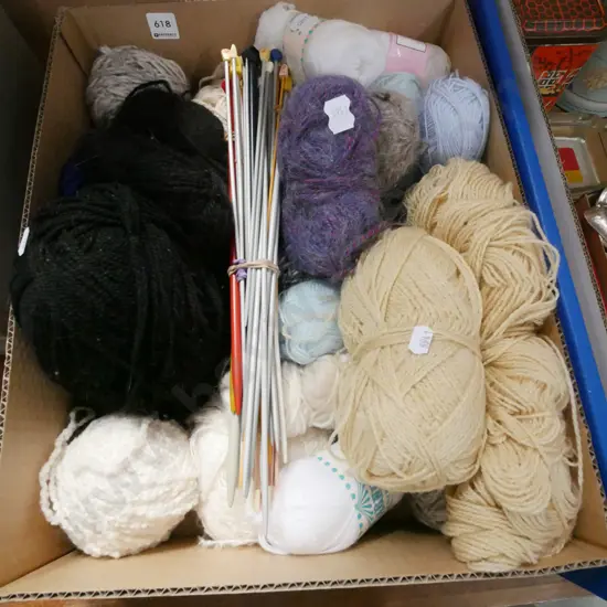 box of knitting yarn and needles