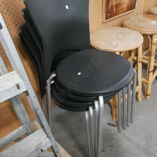 4x black plastic and metal stacker chairs