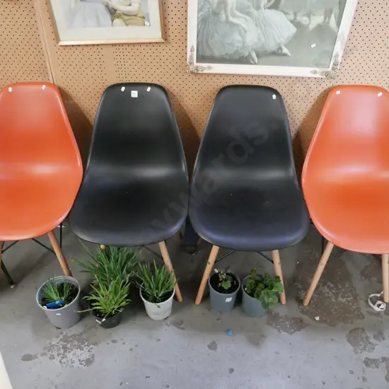 4 plastic and wood dining chairs - 2 black, 2 orange