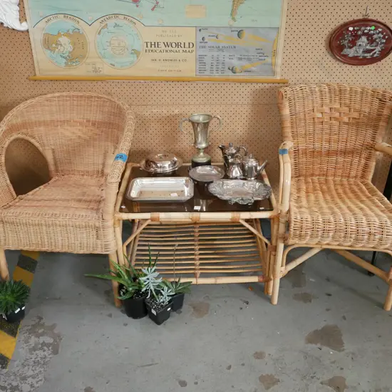 3 piece cane patio suite with 2 mismatched chairs and smoked glass coffee table