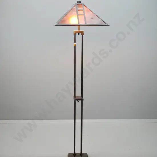 reproduction Frank Lloyd Wright style standard lamp with copper finish metal base, faux parchment plastic panelled shade