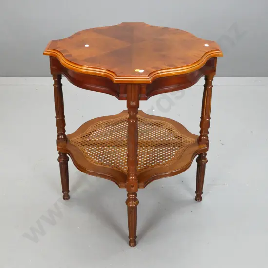 reproduction walnut occasional table with veneered book-matched top, turned legs, lower shelf w/woven cane insert,
