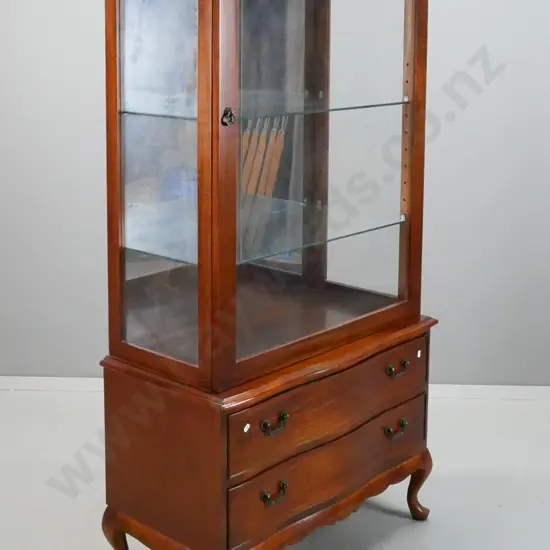 reproduction mahogany display cabinet with shaped top, glazed sides, 2 glass shelves and mirror back, 2 shaped lower