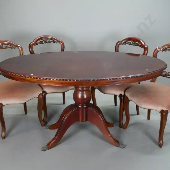 reproduction mahogany oval pedestal base rope-edged dining table with brass paw casters, with 4 balloon back chairs with
