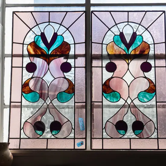 pair of Edwardian stained glass panels - one panel in perfect condition, the other panel has crack to clear mottled