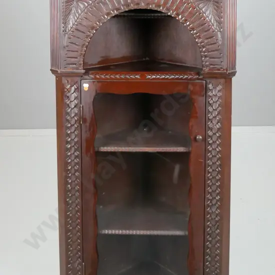 vintage carved cedar corner cupboard with chip-carved decoration, shaped top and glazed door, 2 fixed shelves - some