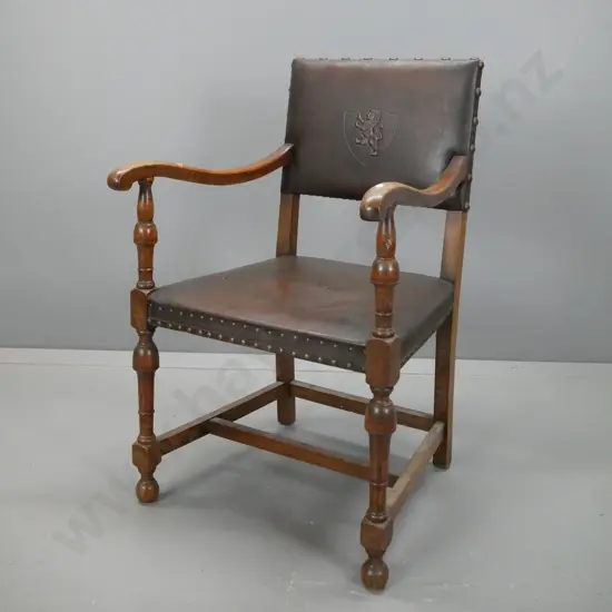 restorer's 1940s vintage oak armchair with stretcher base, brass studded edging to leather upholstery, shield & lion