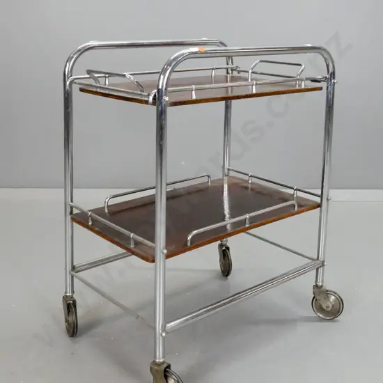 art deco drinks or tea trolley with tubular chrome frame, lift-out timber tray, chrome gallery rails, large rubber