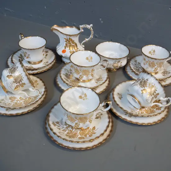 gilt and cream teaware - 6 Royal Albert Golden Glory trios plus a sugar bowl plus a Hammersley milk jug