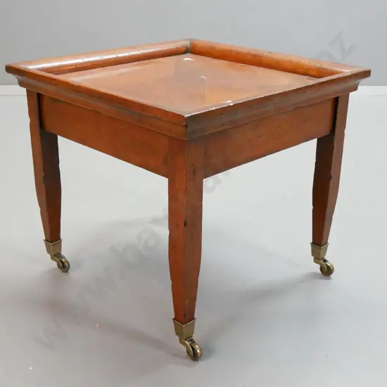 vintage side table with segmented tray top, square tapered legs on brass bucket casters - restored, old borer filled and