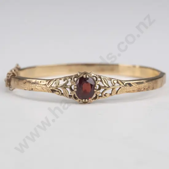 silver bracelet with garnet and safety chain