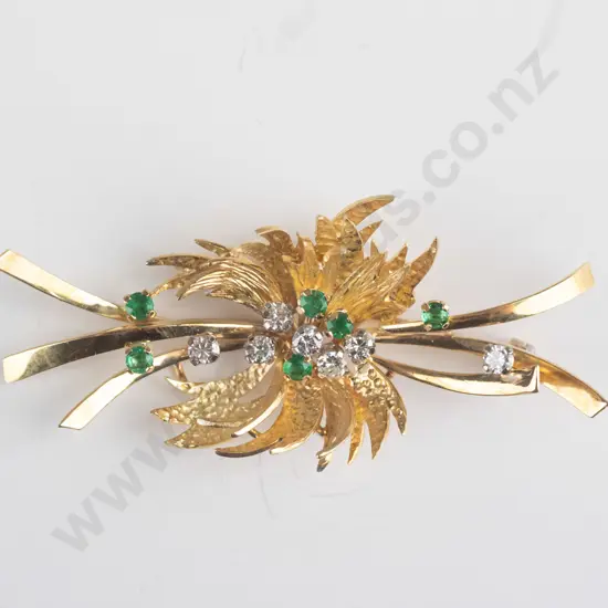 brooch stamped 18ct ribbon bar with pointed leaf forming a spray effect 7 diamonds and greenstones [not tested]