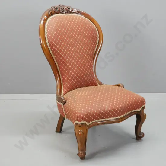 Victorian walnut lady's chair with foliate carved crest on back, serpentine front, cab legs, recovered with diamond