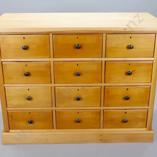 restored vintage kauri chest of 12 drawers with pine top, brass locks, no key, new round metal handles, no back,