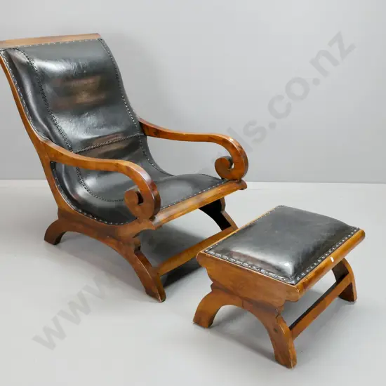 reproduction scrolled open-arm lounge chair with matching foot stool, laced and studded black leather upholstery - some