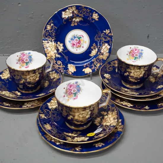 3 Crown Staffordshire hand painted cobalt and gilt trios with spare saucer and plate