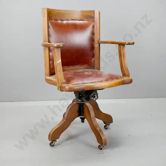 vintage beech swivel open-arm desk chair with studded brown leather upholstered seat and back - marks to seat,