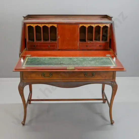 vintage mahogany drop front writing desk with top gallery, boxwood stringing, flame mahogany veneer, green tooled