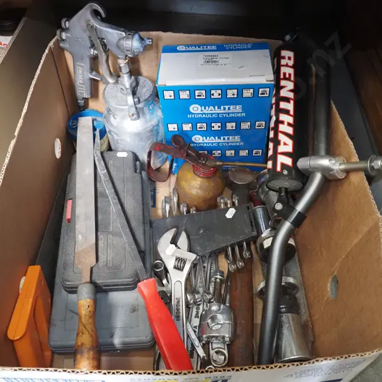 box; motorcycle handle bars, hand saw, crescent etc