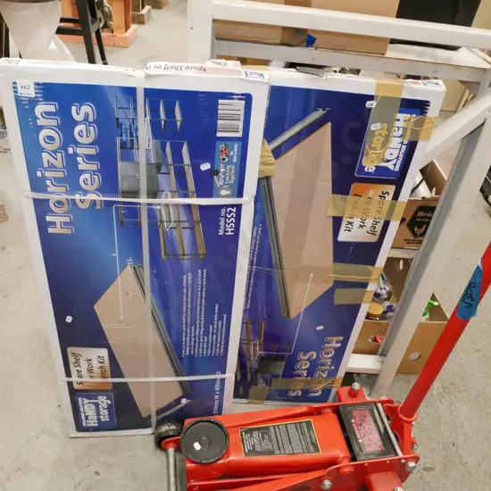 2 boxes of yet to be assembled garage shelving