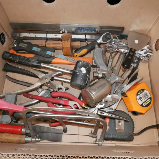 box; rubber mallets, hack saws, rafter squares etc