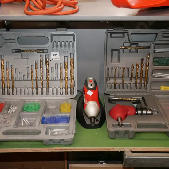 cased drill bits, cased right angle adaptor, Black & Decker screwdriver, drill