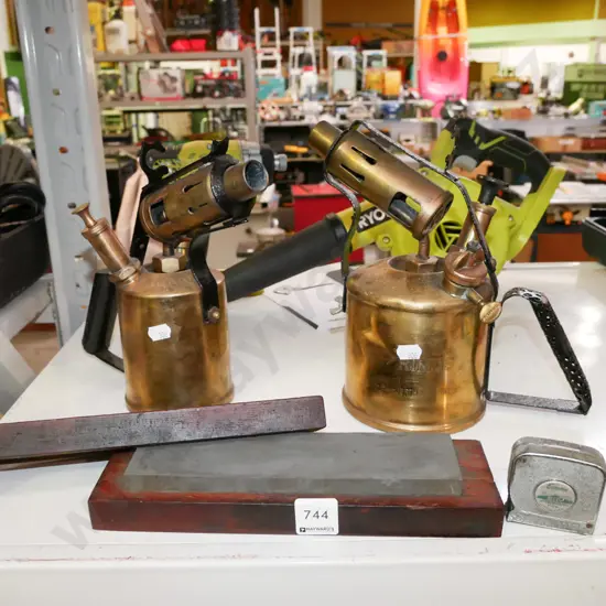 2x brass blow torches, sharpening stone, tape measure
