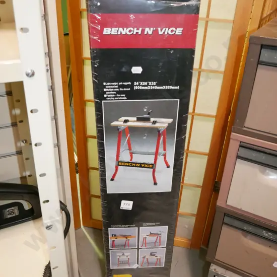 yet to be assembled work bench and vice