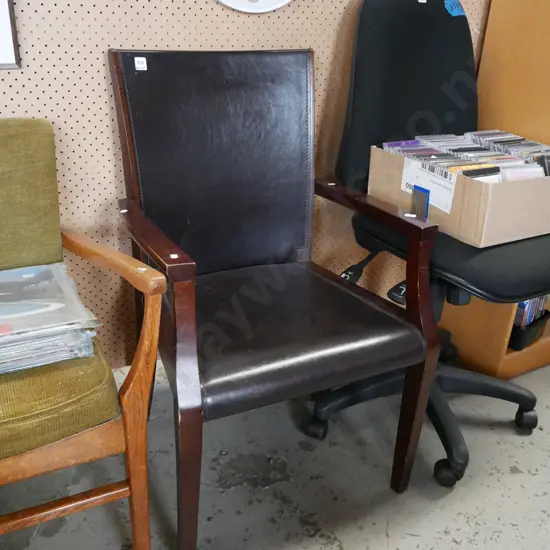 wood and vinyl upholstered armchair
