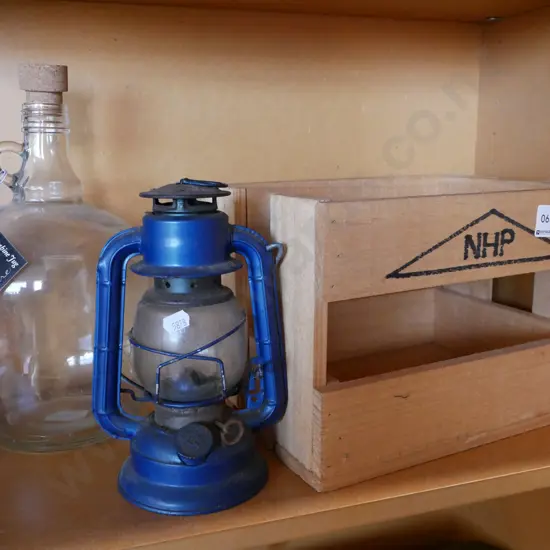 wooden crate, glass umbrella, hurricane lantern
